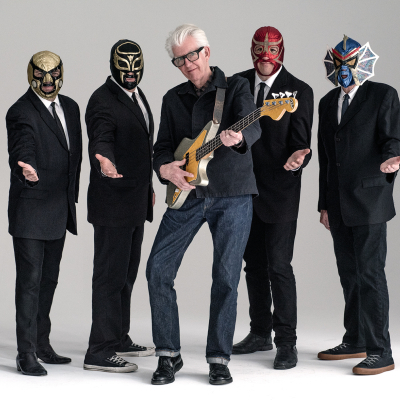 Nick Lowe + Los Straitjackets’ “gracefully raucous” rock revue heads West this fall
